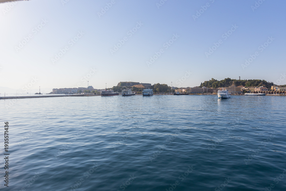 Fototapeta premium Authentic Corfu port view with ferries and Mediterranean architecture