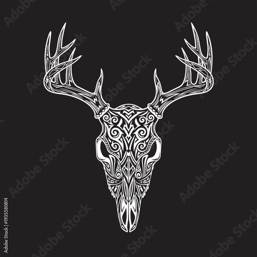 Intricate ornamental deer skull with elaborate patternwork and symmetric antlers on dark backdrop.