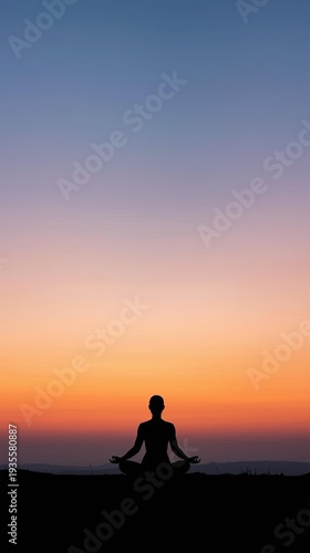 Silhouette of a Person Meditating Against a Colorful Sunset Sky