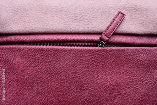 Pink leather bag. Detail of a colored leather bag with a zipper