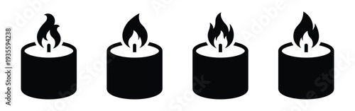 Four black candles with flames burning on top