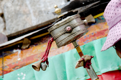 Photos Handheld Tibetan Buddhist Prayer Wheel Held by a Pilgrim