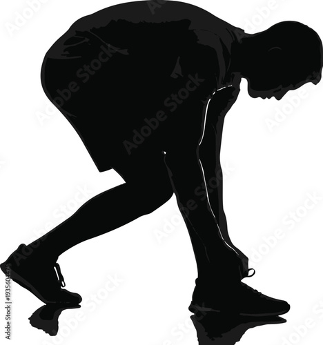 Athlete Prepares for Action: A determined runner ties his shoelace, embodying anticipation and readiness for the challenge ahead, setting the stage for a race or workout. 