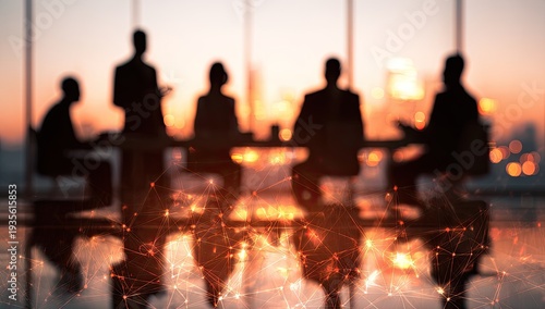 Silhouetted business people in meeting with city skyline backdrop