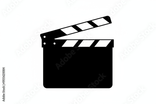 Cinema's Genesis: A minimalist yet iconic shot of a classic film clapperboard, its stark design evoking the anticipation and art of movie making.