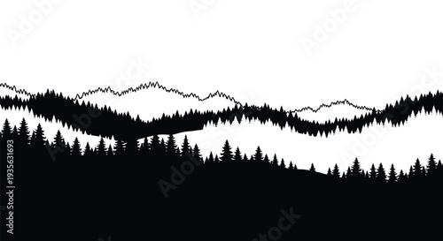 Dramatic mountain range landscape with dense forest striking silhouette