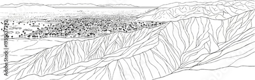 Aerial view of a sprawling city nestled between arid mountains and a distant body of water