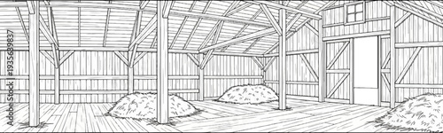Interior view of an old wooden barn with haystacks and open sliding doors