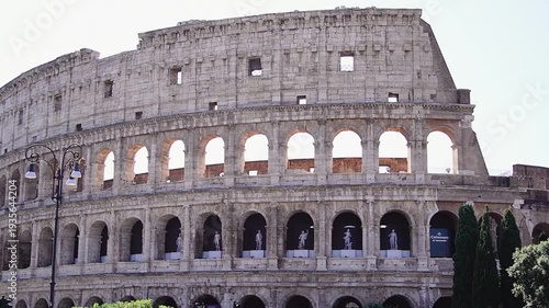 Beautiful exterior view of the historic Roman Colosseum amphitheater and the surrounding cityscape of Rome