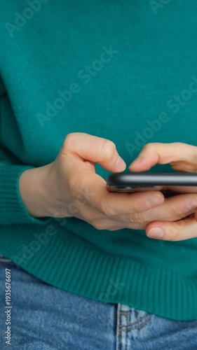 Close up of female using mobile phone app in slow motion