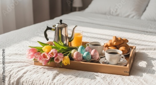 Easter Breakfast in Bed: A delightful Easter breakfast tray on a crisp, inviting bed. Featuring coffee, orange juice, croissants, beautifully decorated eggs, and vibrant tulips.