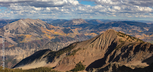 This scenic autumn mountain panorama was captured from atop Mount Gunnison and features the beautiful Elk Range peaks adorned with colorful aspen trees.