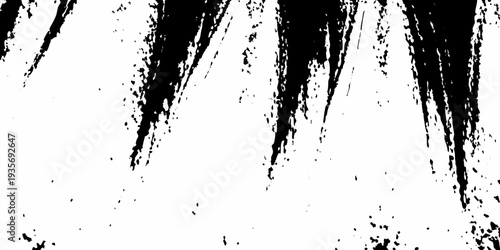Abstract black brushstrokes and splatters against a stark white background
