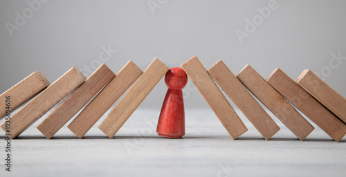 Wooden human figures with a wooden blocks.