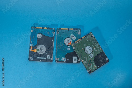 Three Hard Disk Drives on a Blue Background