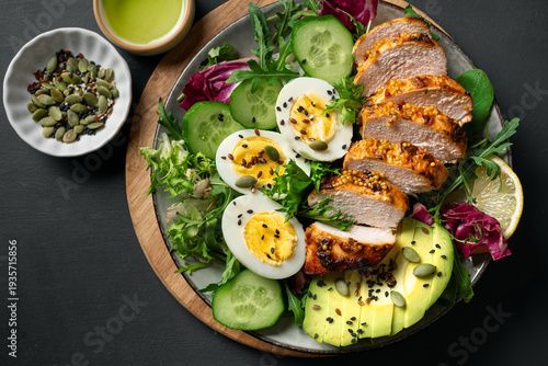 High protein lunch bowl with chicken, eggs and vegetables