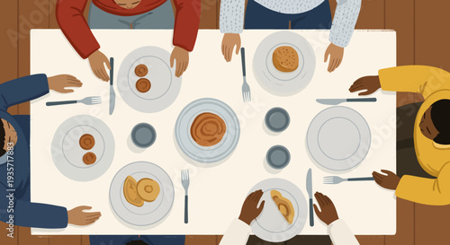 People sitting around a table with plates of food and utensils