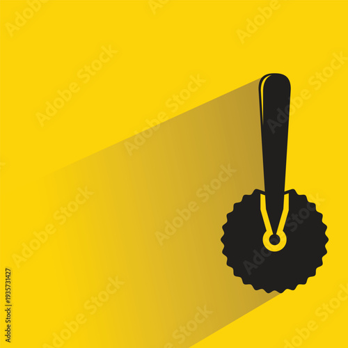 pizza cutter icon with shadow on yellow background