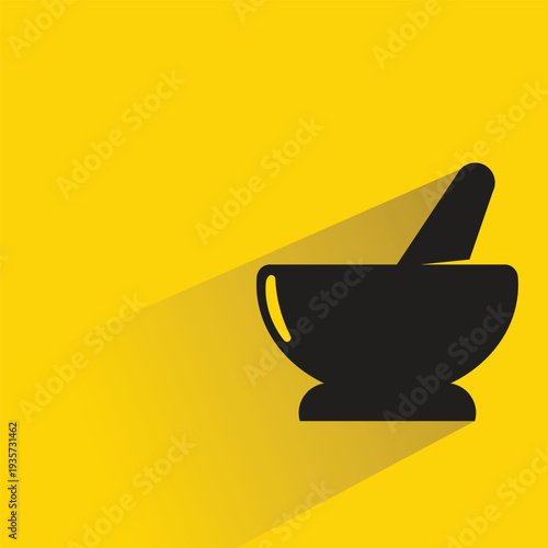 herb mortar and pestle icon with shadow on yellow background