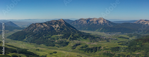 This scenic summer mountain panorama features Mt Crested Butte and Whetstone Mountain rising above the towns of Mount Crested Butte and Crested Butte, Colorado.