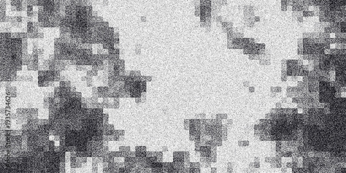 Abstract pixelated grayscale background with a grainy texture and irregular blocky shapes creating a digital mosaic effect for graphic design and digital art