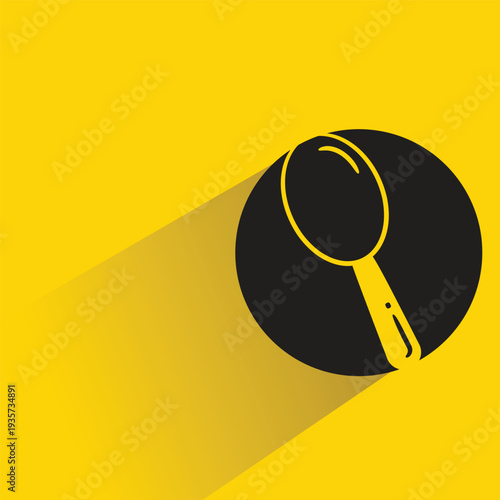 spoon icon with shadow on yellow background