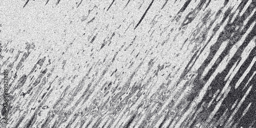 Diagonal abstract grayscale pattern with linear elements and granular texture, suggesting movement or a textured surface for dynamic backgrounds and graphic design projects