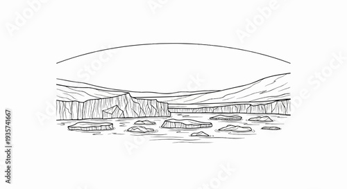 Stark landscape of icebergs floating in cold water beneath glacial cliffs