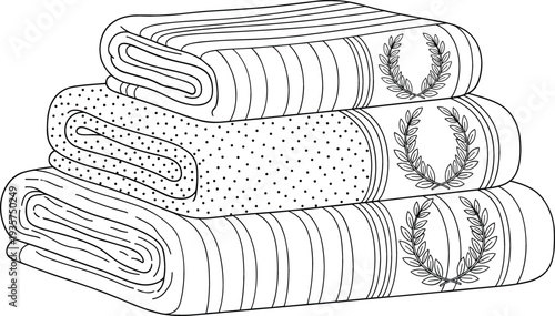 Stack of three folded towels with laurel wreath embroidery isolated on white for spa hotel and bathroom decor