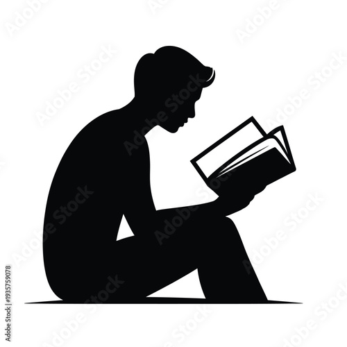 Silhouette of a person deeply engrossed in reading a book