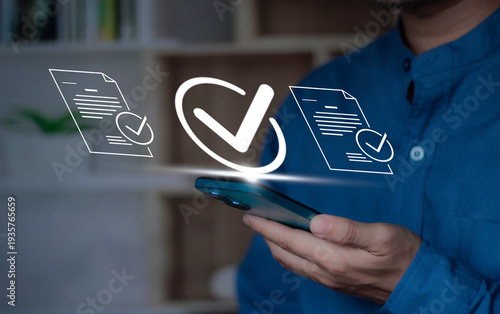 checkmark for digital approval and task completion. online procurement documents, contract warranties and licenses on mobile procurement devices for businesses and startups