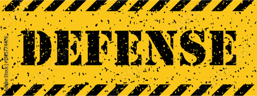 Grungy yellow caution banner featuring black stripes and the bold uppercase word DEFENSE centrally positioned
