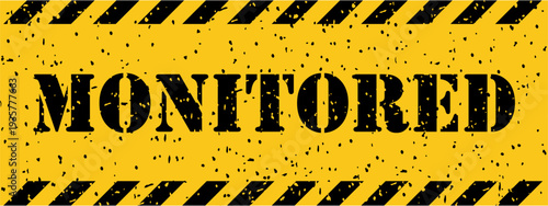 Yellow and black distressed banner with diagonal stripes clearly showing the word MONITORED