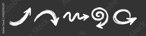 Set of hand-drawn white chalk arrows on a dark background. Gritty, textured brush strokes in various shapes like spiral, wavy, and curved.