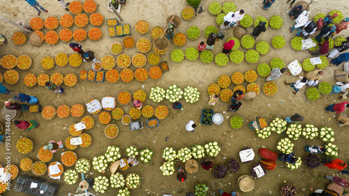 Aerial view of vibrant fruits forming a colorful tapestry at Baishmouja bazar main road, a lively scene of commerce and community interaction, Brahmanbaria, Bangladesh.