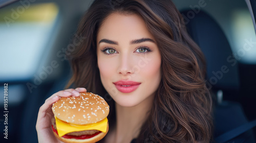 A woman eating fast food in a car