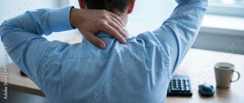 Wallpaper Mural Office worker touching painful neck at desk, concept of neck pain and office syndrome Torontodigital.ca