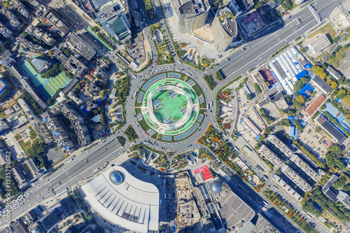 Cuadro en lienzo Wuhan City Plaza Aerial View - Circular Stadium and Urban Complex