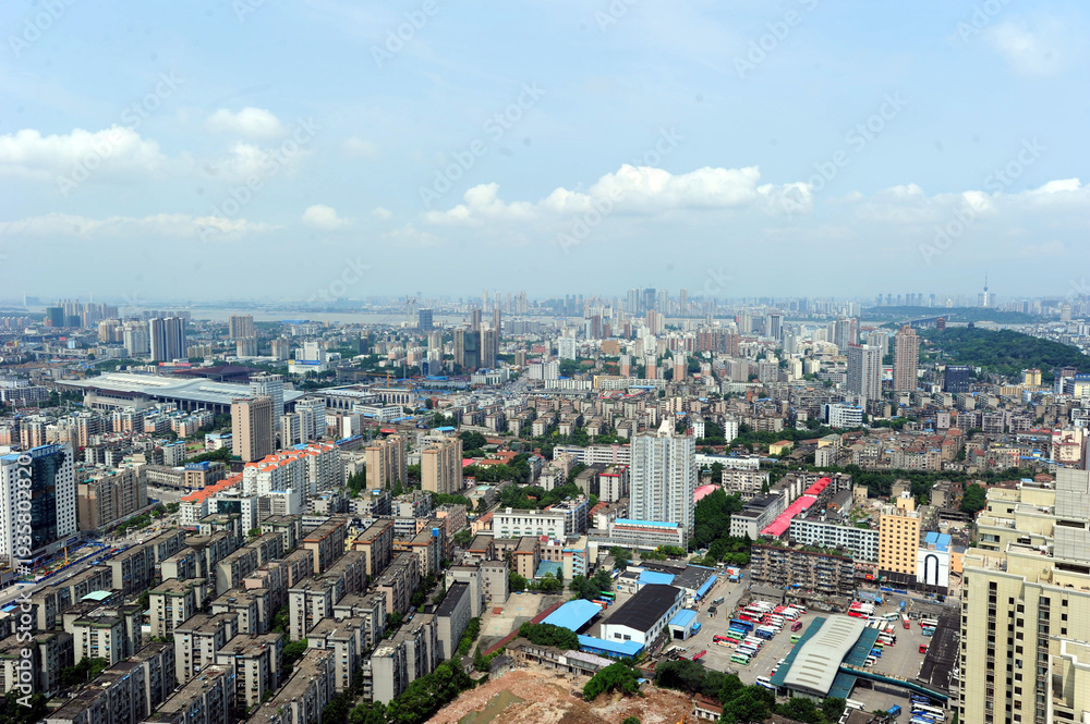 Obraz premium Aerial Cityscape After Rain with River and Urban Skyline