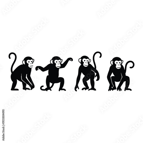 Four black silhouettes of monkeys in different poses