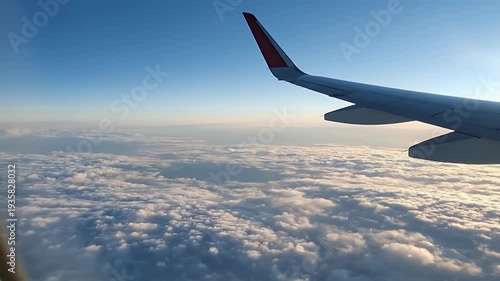 Flying High Above the Clouds - A Stunning Aerial View.