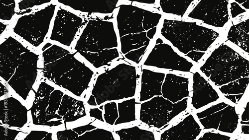 Cracked dry earth surface pattern with shattered desert soil texture and irregular broken ground