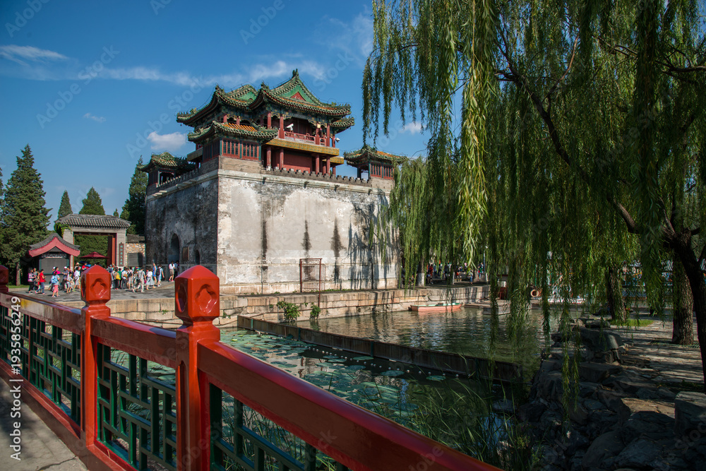 Fototapeta premium Summer Palace Tower Beijing - Traditional Chinese Architecture and Waterway