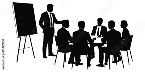 Silhouette of business meeting with presenter at flip chart and people around table Keywords: business, meeting, presentation