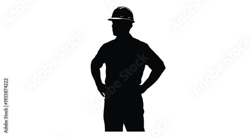 A stark black silhouette of a construction worker wearing a hard hat standing with hands on hips silhouette