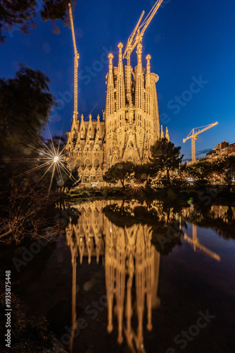 Sagrada Familia Barcelona Spain Illuminated at Dusk with Water Reflection