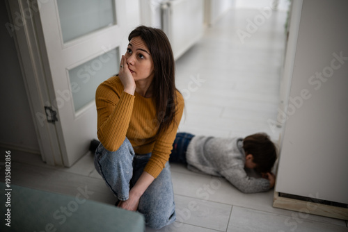 Photos Stressed mother experiencing parenting burnout with child having tantrum