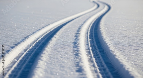 Winding ski tracks imprinted on pristine fresh snow surface. Parallel ski tracks delineate clear path for winter adventure, sparkling brightly. Concept ski tracks for winter sports advertising,