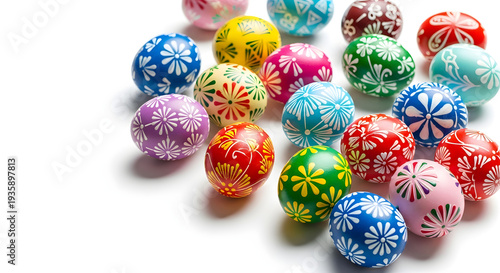 A collection of colorful Easter eggs with intricate designs on a white background