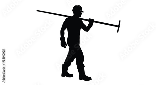 A solitary worker carrying a long handled tool walks forward depicted in a striking black silhouette high quality professional detailed